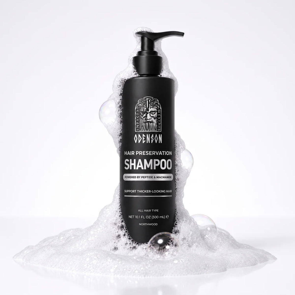 Odenson Hair Preservation Shampoo black pump bottle standing in soft white foam